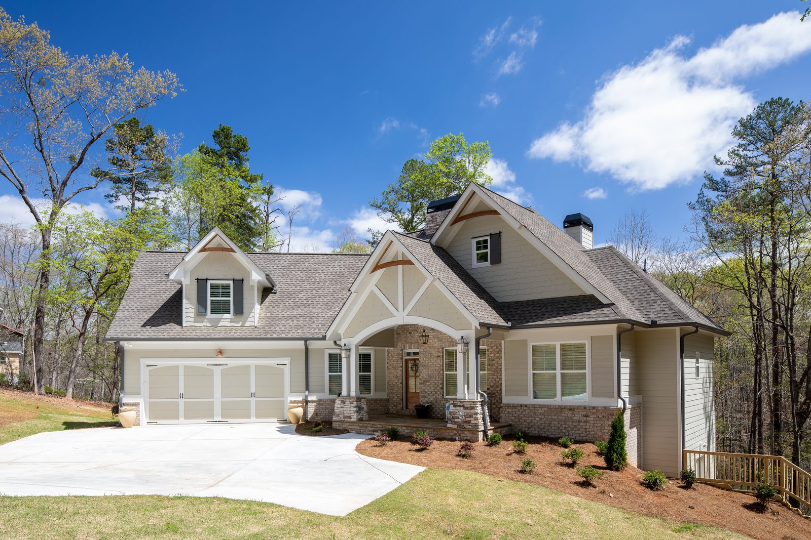 Craftsman front elevation seen from the yard — Spring 2020 Custom Home, custom home built by Ironwood Construction Group
